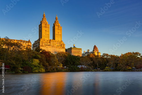 Sunrise on Upper West Side building and Central Park Lake. Manhattan, New York City