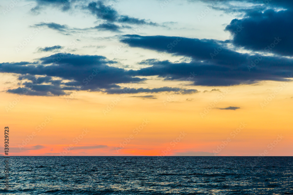 Sunset over the beach of ocean