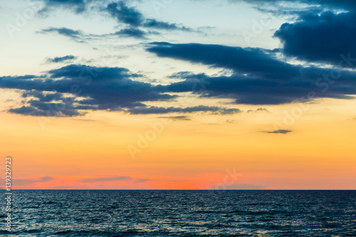 Sunset over the beach of ocean