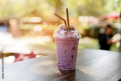 Blueberry Smoothie in a Glass with Straw photo