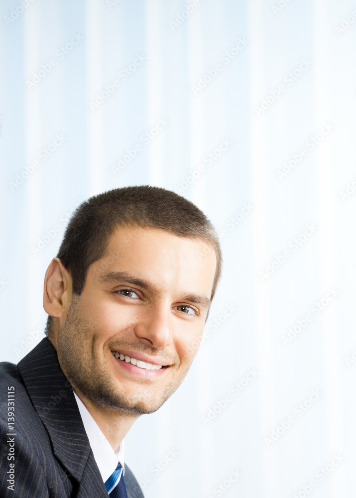 Portrait happy smiling business man at office Portrait happy smiling business man at office