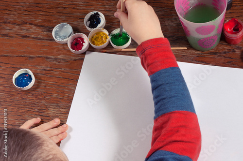 brush for painting in child hand draw photo