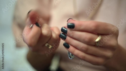 A woman goes through in the hands of the jewelry.