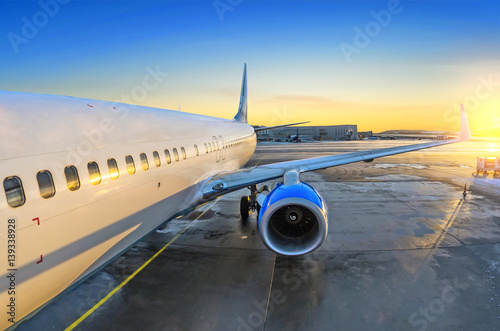 Airplane view of the passenger at the entrance, sunrise and parking in the airport engine