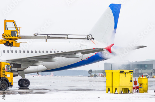 Airport in winter Deicing of the airplane departire