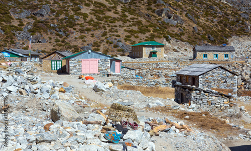 View of Nepal Mountain Village and Household Items on Foreground