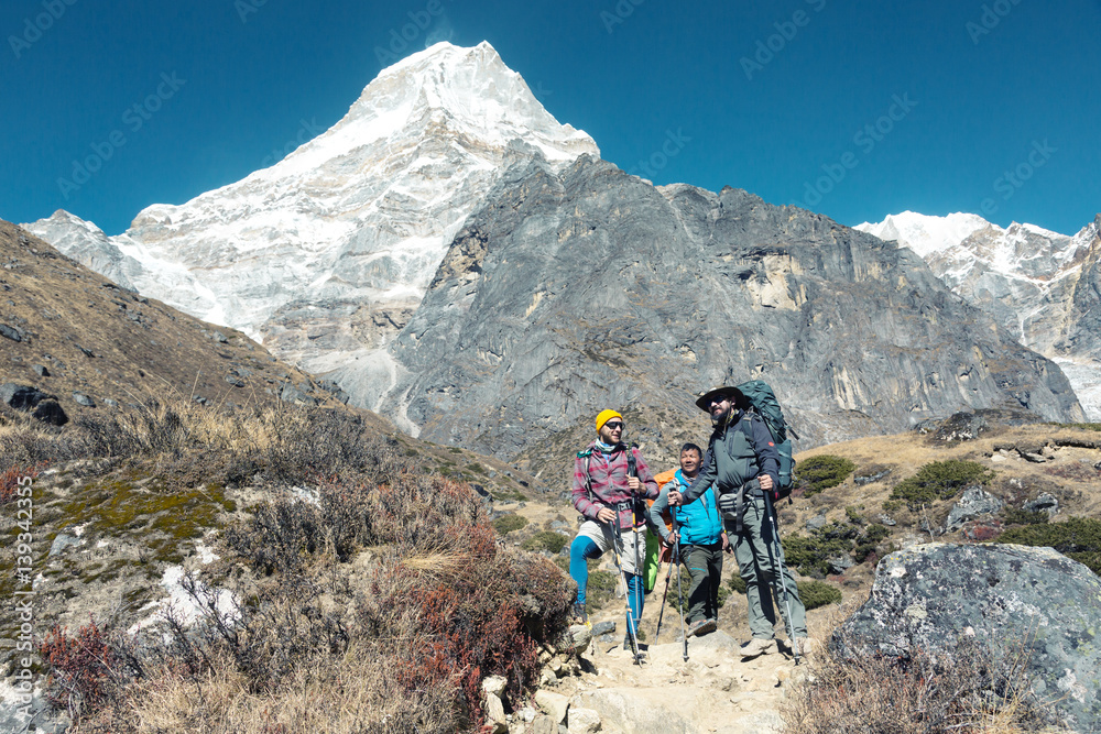 Hikers staying on Footpath in high Mountains