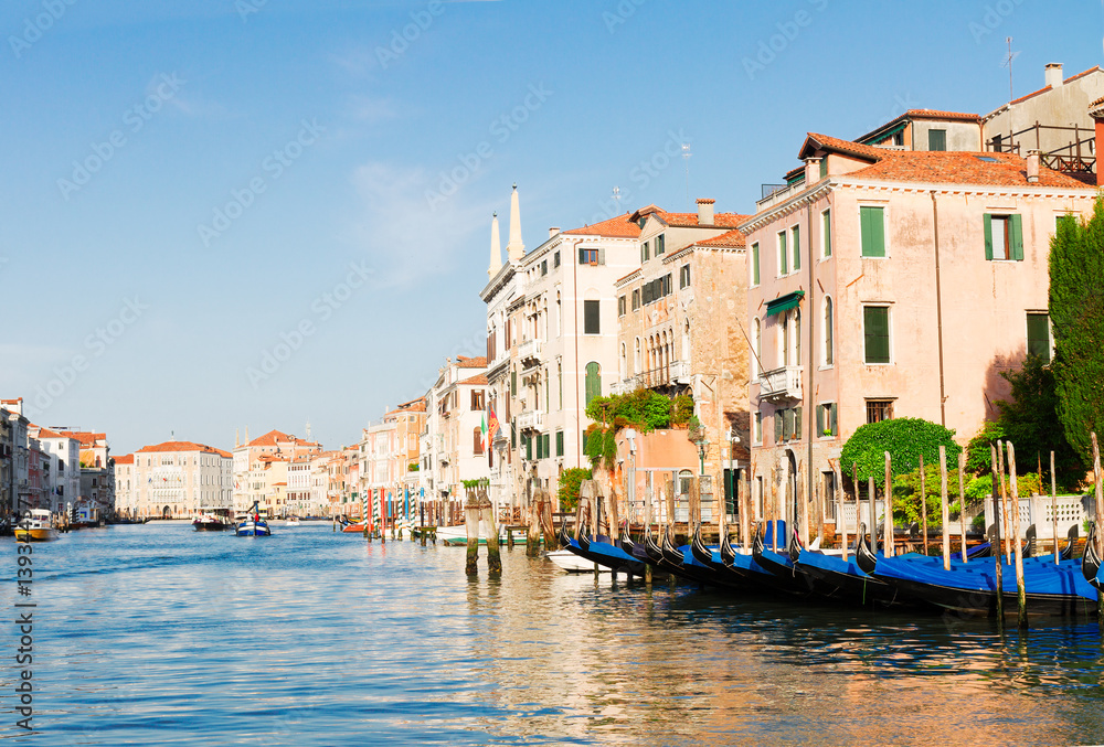 colorful traitional Venice gondola boats and houses over water of Grand canal, old town of Venice, Italy
