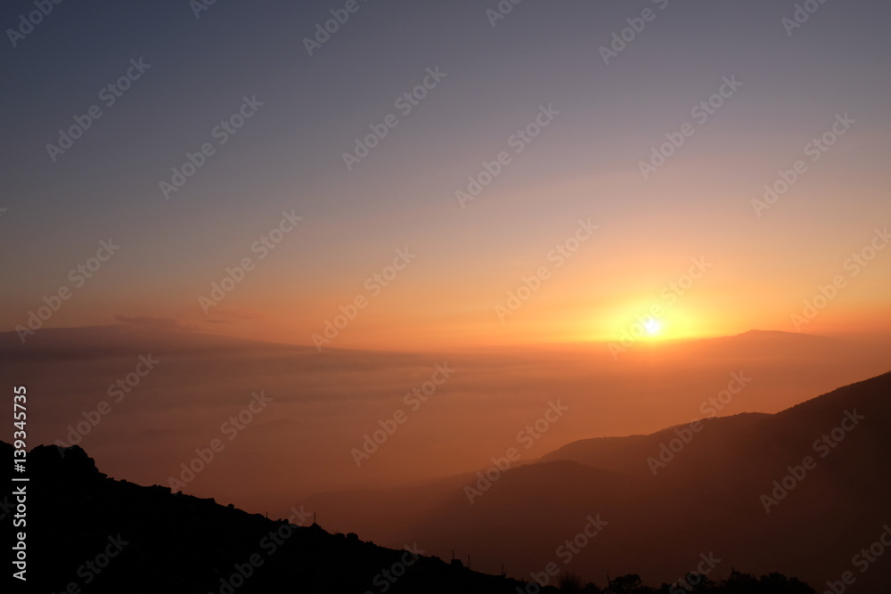 Sunset over from the peak of Mauna Kea