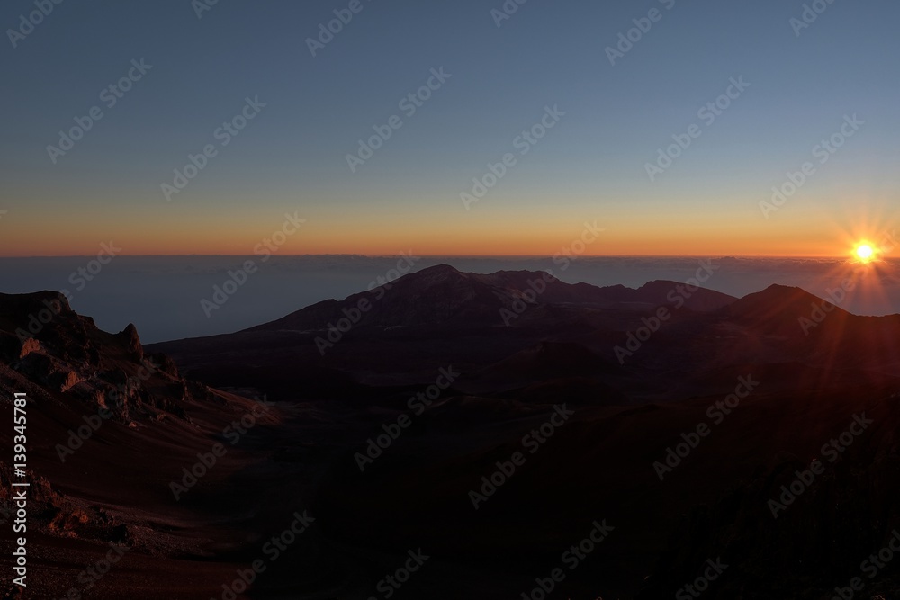 Sunrise breaks at Mount Haleakala, Maui