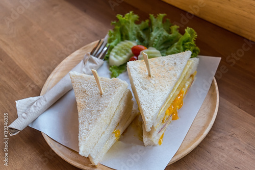 slice ham cheese egg sandwich breakfast with fresh vegetable