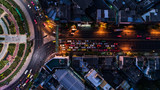 Road roundabout with car lots Wongwian Yai in Bangkok,Thailand. street large beautiful downtown at evening light.  Aerial view , Top view ,cityscape ,Rush hour traffic jam