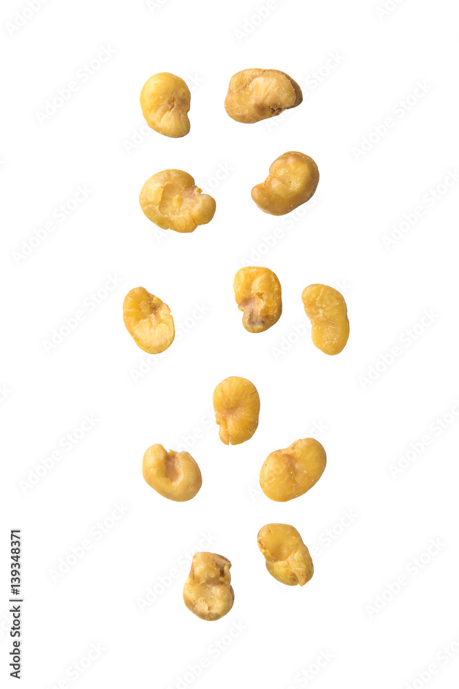 Falling salted broad beans on white background. Falling salted broad beans on white background.