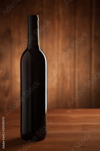 bottle of wine on an old wooden table