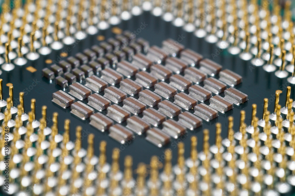 A computer motherboard with half of CPU High technology close up A computer motherboard with half of CPU High technology close up