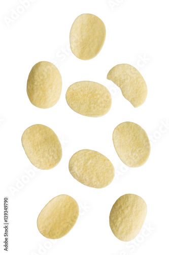 Falling potato chips on white background.