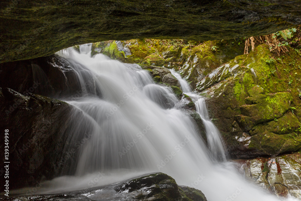 Fototapeta premium Waterfall from inside cave