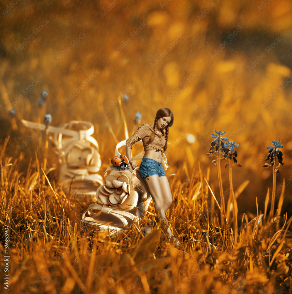 Φωτογραφία Creative beautiful orange toned photo manipulation with a girl near the giant sh