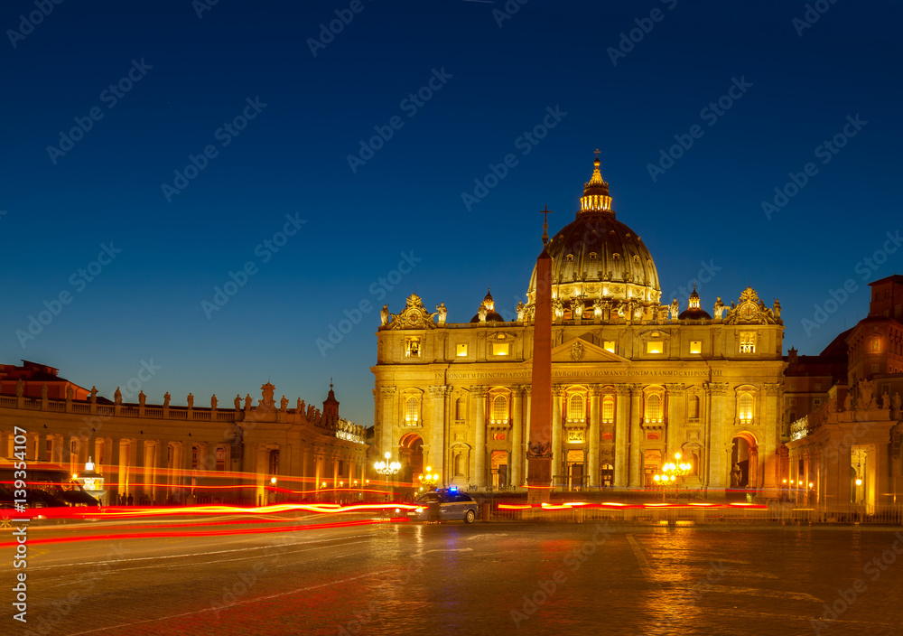St. Peter's square and cathedral in Rome at night with lights, Italy