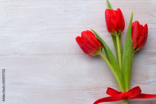 Red tulips, spring flowers and Easter decoration.