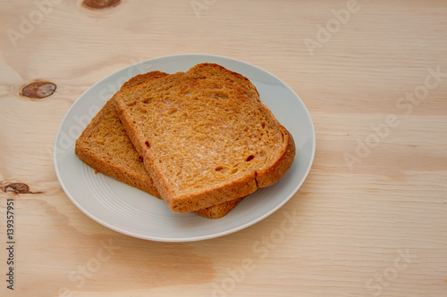 slices of toasted wheat bread on a wooden table