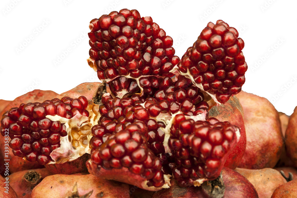 pomegranate fruit in expanded form lies on the other fruits pomegranate fruit in expanded form lies on the other fruits