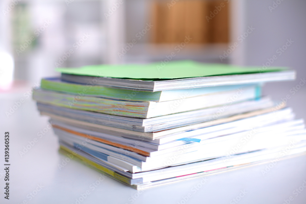close up of stack of papers on white background close up of stack of papers on white background