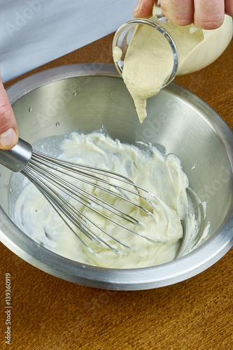 chef whisk mayonnaise in a bowl in hand a series of full cooking food recipes