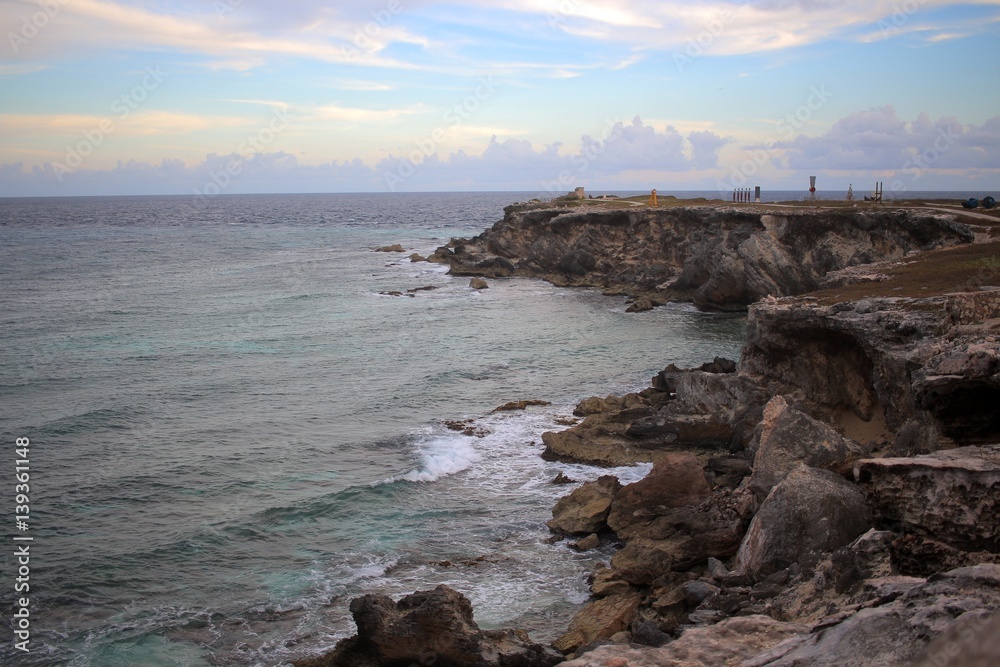 Caribbean Sea meets rocky shore of Isla Mujeres, Mexico.