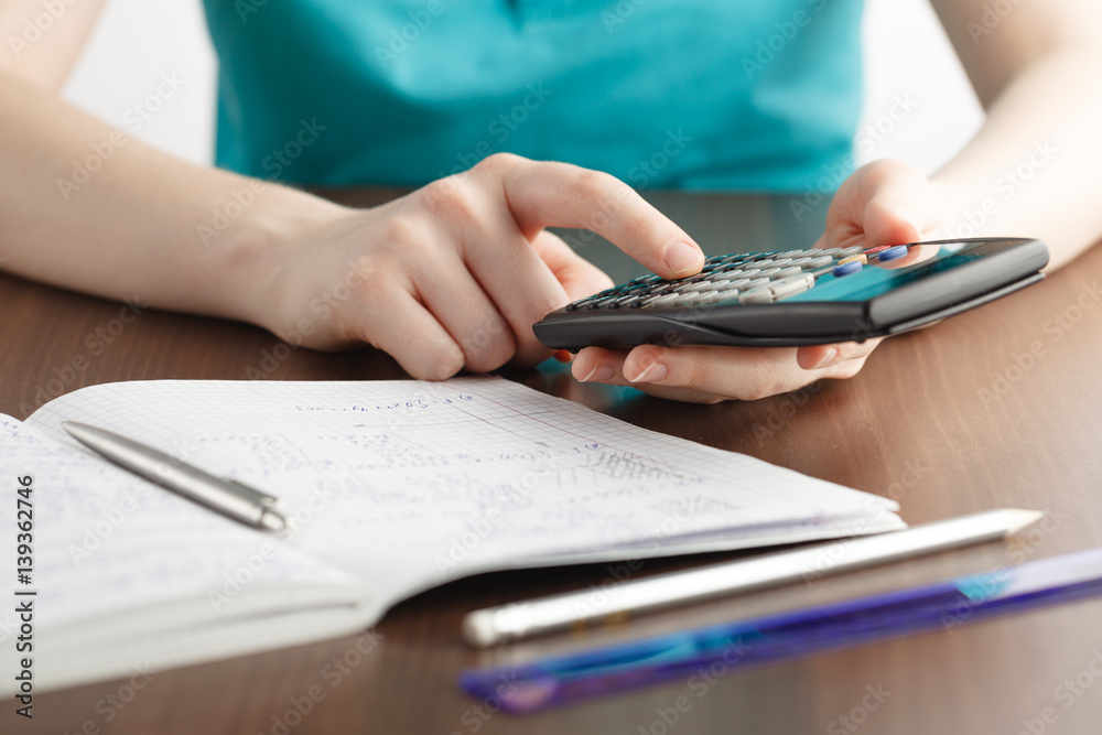 girl solving a math problem girl solving a math problem