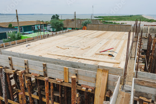 The process of building a house. Wooden flooring floor under the floor slab with beams under the pouring of concrete