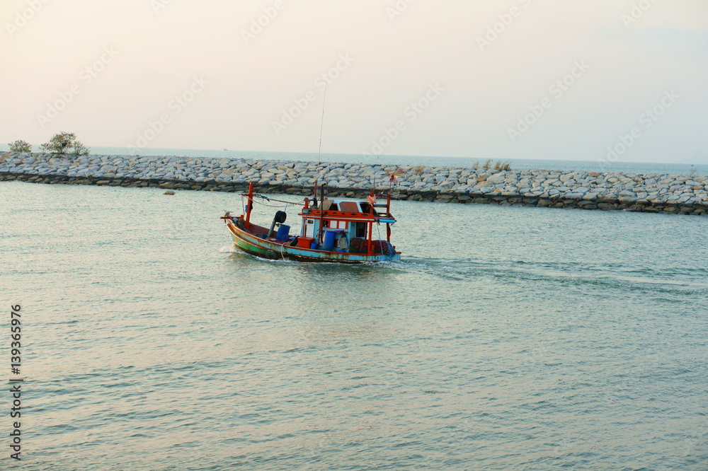 Fishing boat out to the sea