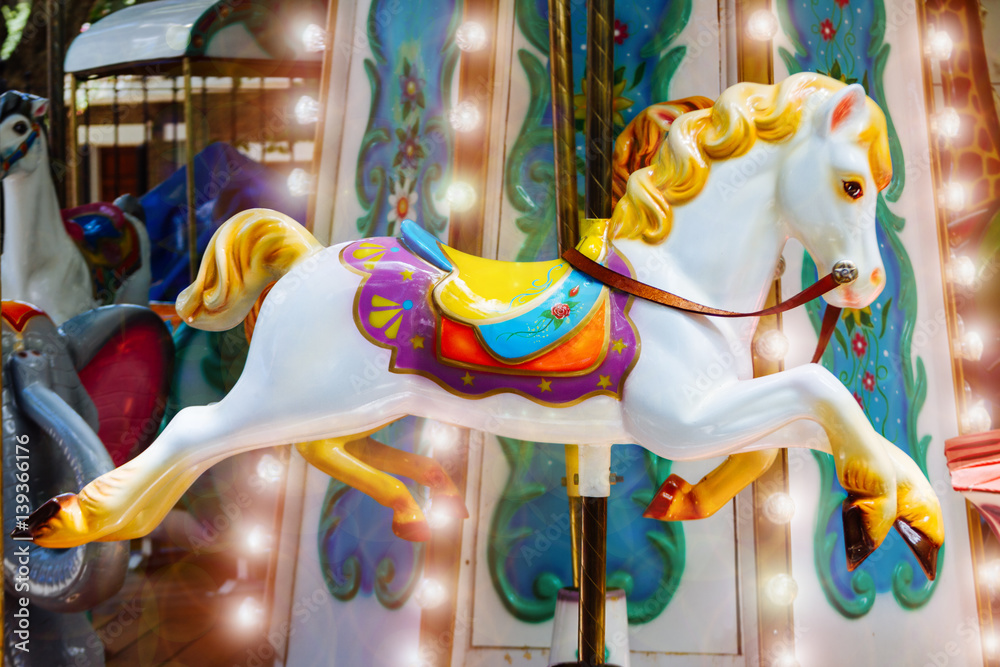 Horse of merry-go-round with lights and flare without people