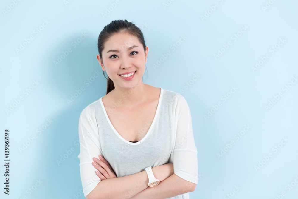 young pretty woman against wall young pretty woman against wall