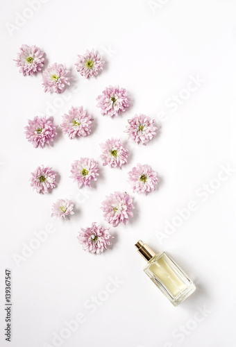 Bottle of fragance coming out flowers