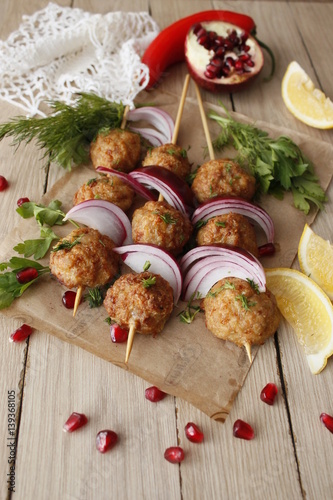 Kofta skewers, meatballs and red onion delicious oriental cuisine, top view