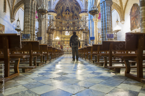 Tourist at Guadalupe Monastery Basilica, Spain photo