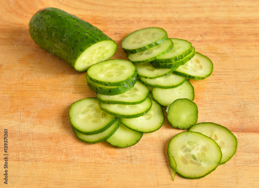 Green cucumber on wooden.