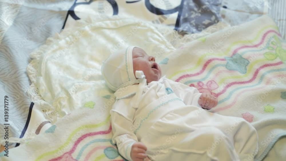 Newborn baby lying on the bed. Newborn baby lying on the bed.