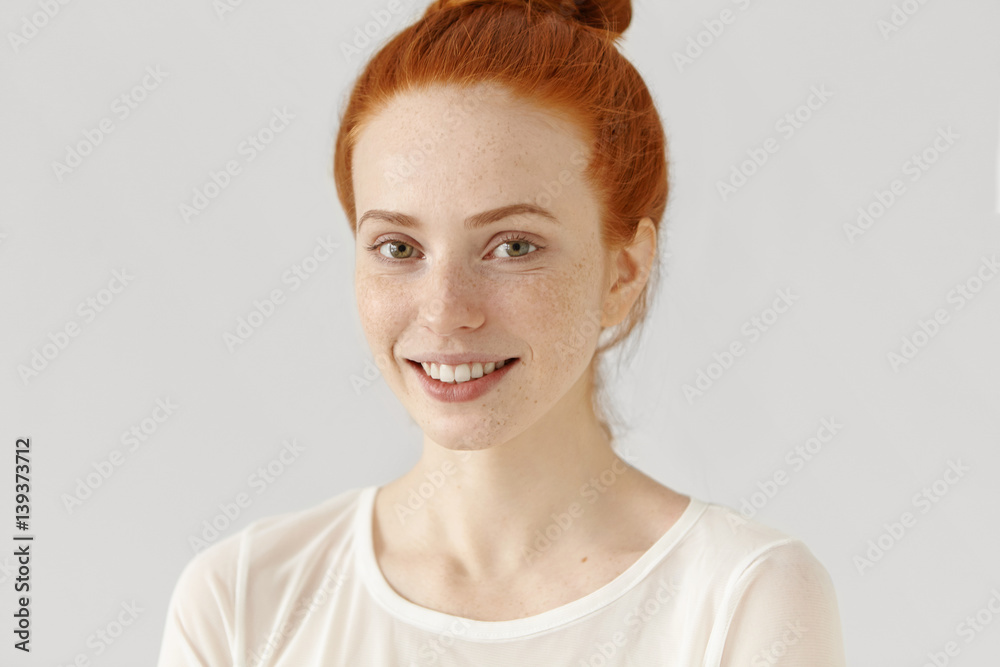 Φωτογραφία Half profile of beautiful redhead girl with healthy freckled skin and hair bun s