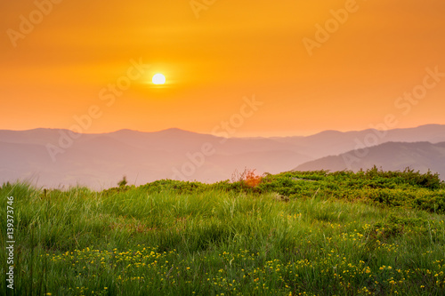 Majestic sunset in the mountains landscape. orange sky.