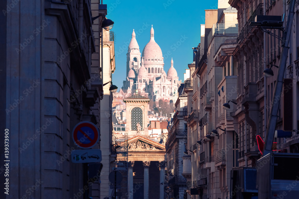 Sacre-Coeur Basilica or Basilica of the Sacred Heart of Jesus and Notre-Dame de Lorette church, seen from Rue Laffitte in the winter morning, Paris, France