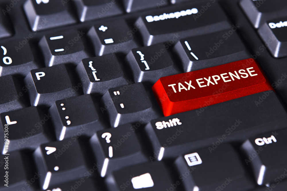 Computer keyboard with text of tax expense Computer keyboard with text of tax expense
