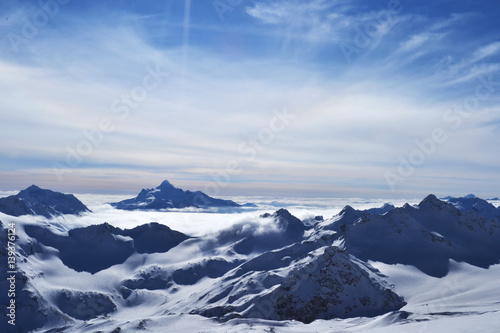 Beautiful view on the winter mountains. amazing landscape with ridge, blue sky, floating clouds.