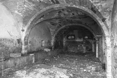 black and white interior view of an abandoned house 