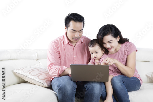 Happy family watching a movie on a laptop