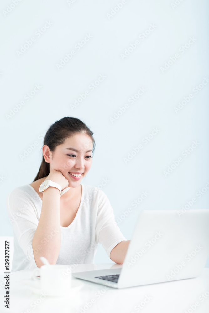young pretty woman using laptop in office young pretty woman using laptop in office