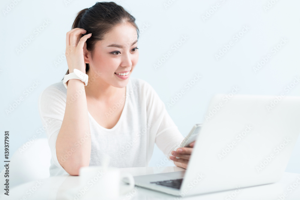 young pretty woman using laptop in office young pretty woman using laptop in office