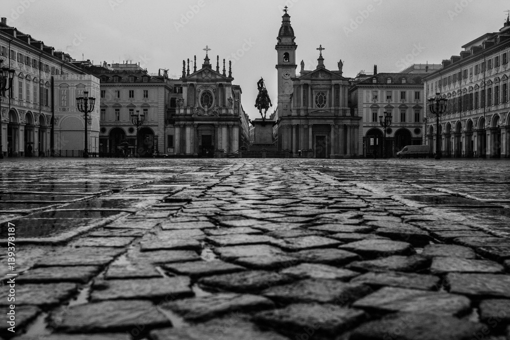 Turin (Torino), Italy - February 15, 2017: Big cobblestone (stones) of the Piazza San Carlo royal square in Turin (Torino), Italy- black and white version 