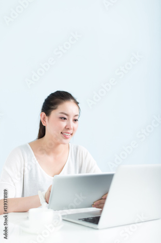 young pretty woman using laptop in office